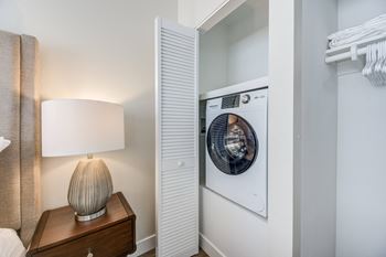 A washer and dryer in a bedroom